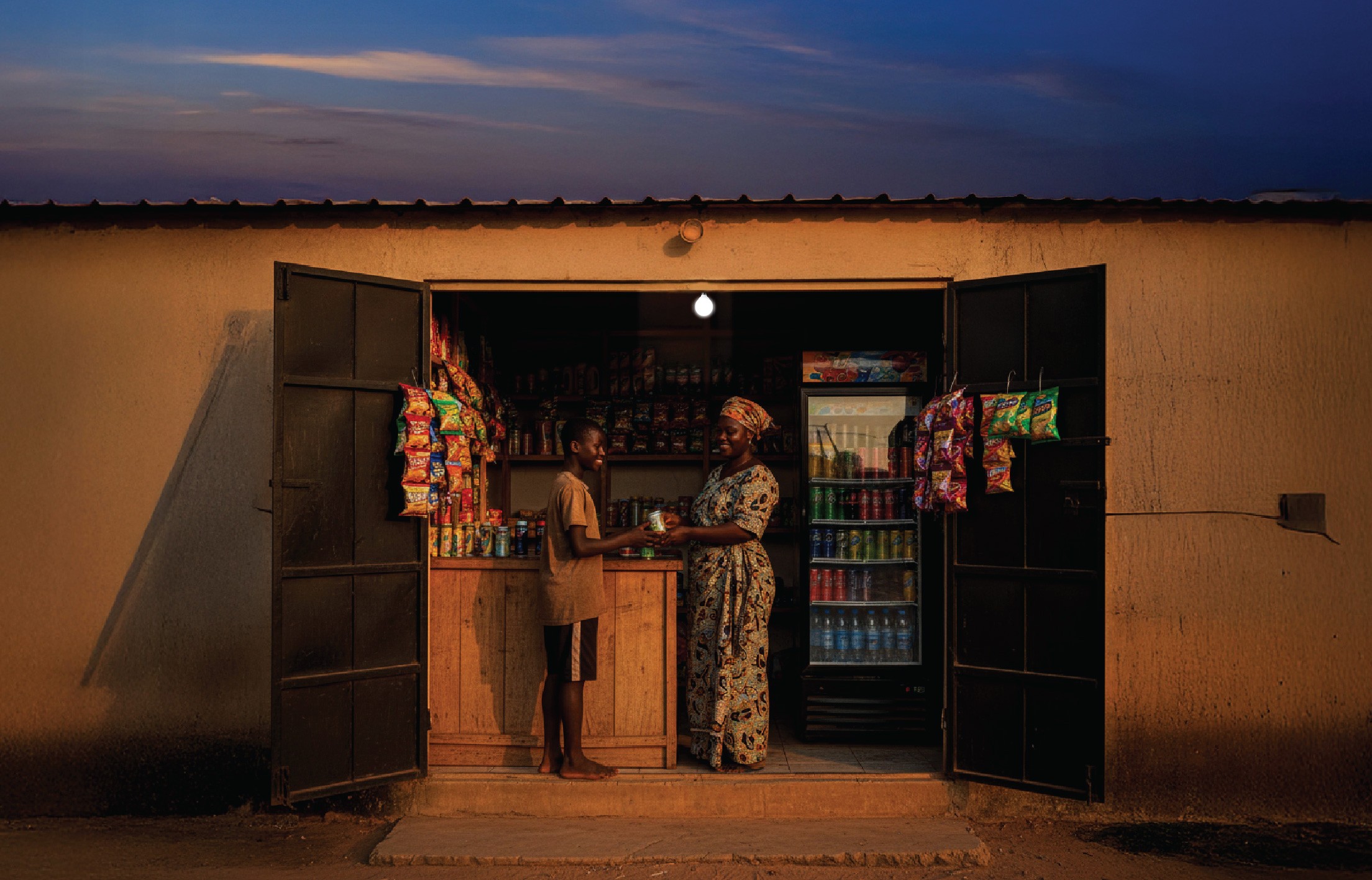 Community member at a solar-powered shop